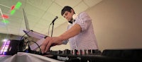 a man playing a dj at a party